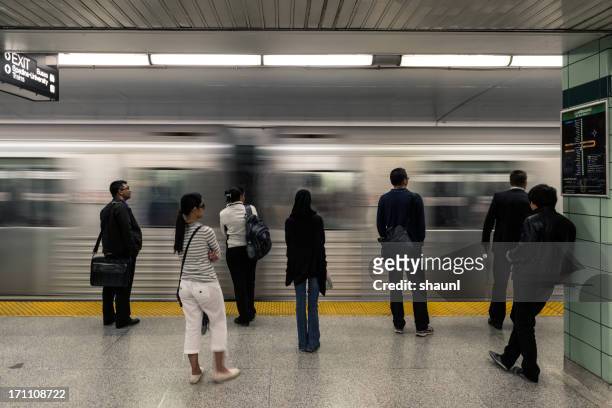 waiting for the green line - toronto subway stock pictures, royalty-free photos & images