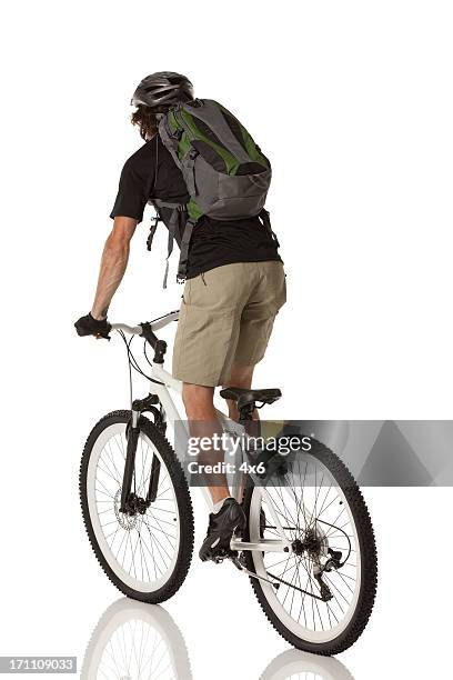 rear view of cyclist riding a bicycle - bicycle isolated stockfoto's en -beelden