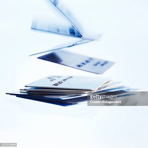 falling credit cards - credit card and stapel stockfoto's en -beelden