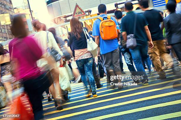 Walking Against Crowd Rear View Photos and Premium High Res Pictures ...