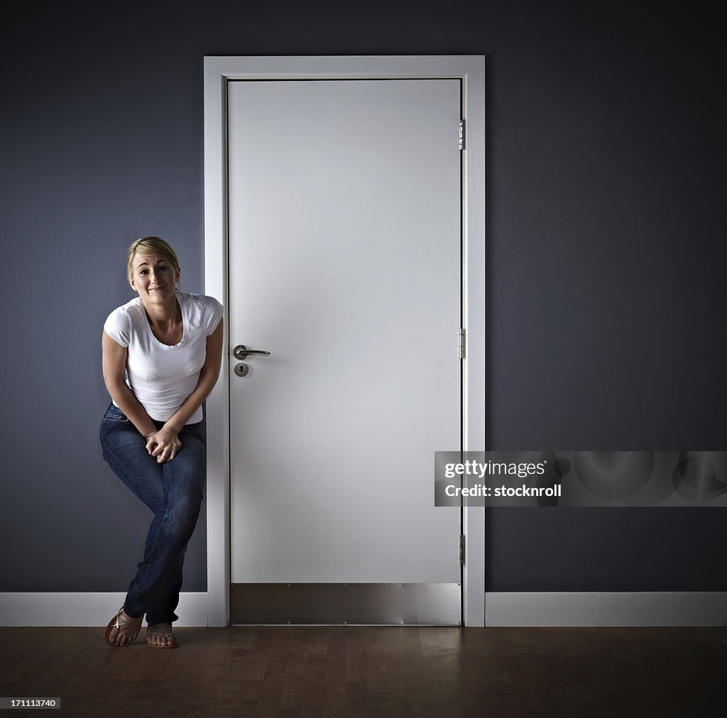 Woman waiting outside ladies toilet