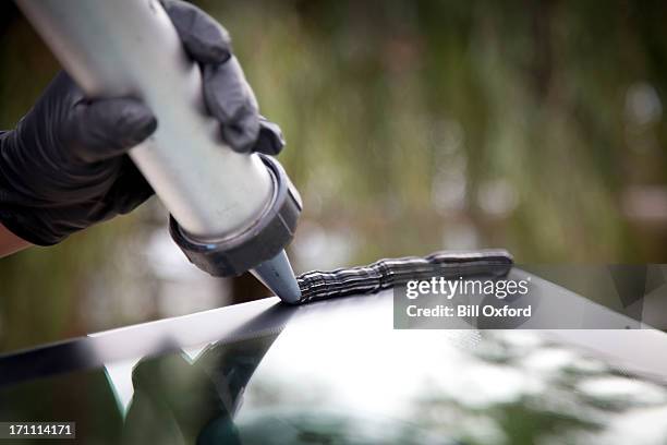 auto glass repair & replacement - glue industry stock pictures, royalty-free photos & images
