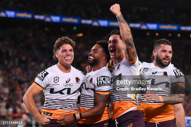 Ezra Mam of the Broncos celebrates with team mates after scoring a try during the 2023 NRL Grand Final match between Penrith Panthers and Brisbane...