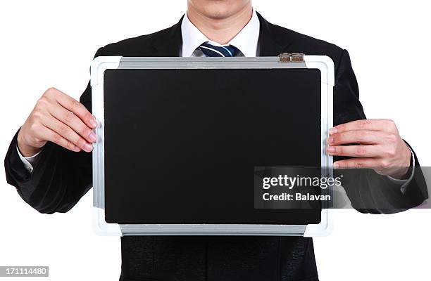 business people holding a blank blackboard - showing card stock pictures, royalty-free photos & images