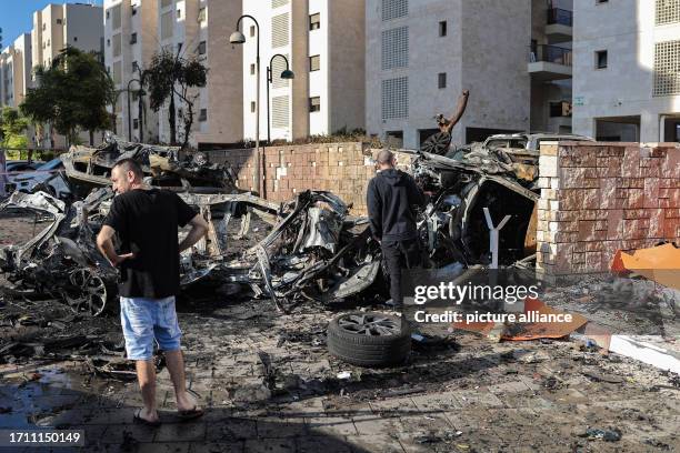 October 2023, Israel, Ashkelon: Israelis inspect damage caused by a rocket attack from Gaza. Palestinian militants in Gaza unexpectedly fired dozens...