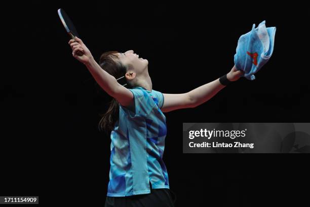 Hina Hayata of Japan celebrates after defeating Wang Yidi of China in their women's singles semi-finals table tennis match during day 8 of the 2022...