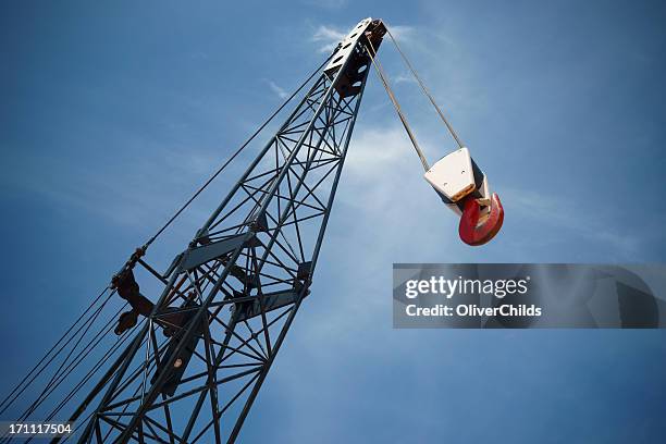 crane boom and hook with sky background. - construction cranes stockfoto's en -beelden