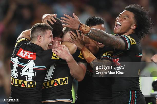 Nathan Cleary of the Panthers celebrates with team mates after scoring a try during the 2023 NRL Grand Final match between Penrith Panthers and...