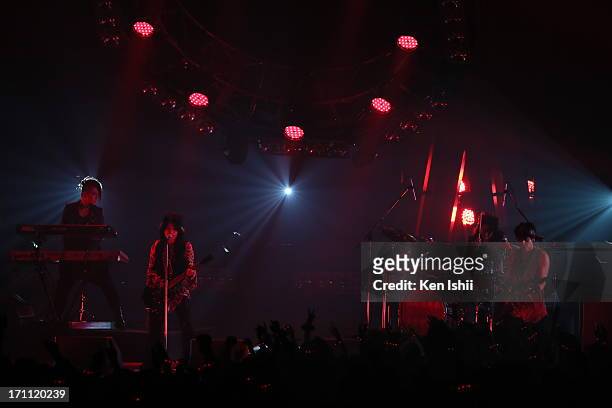 And K.A.Z of VAMPS perom onstage during the MTV VMAJ 2013 at Makuhari Messe on June 22, 2013 in Chiba, Japan.