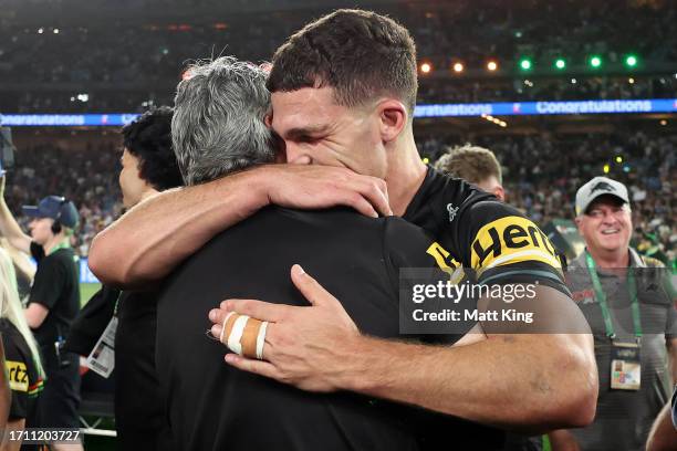 Nathan Cleary of the Panthers celebrates with his father and coach Ivan Cleary after winning the 2023 NRL Grand Final match between Penrith Panthers...