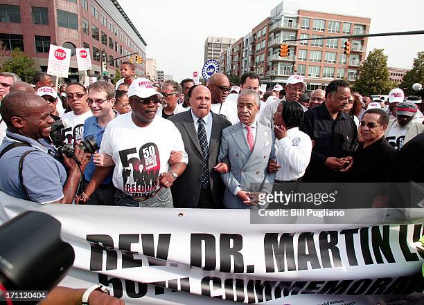 Martiin Luther King III, Rev. Al Sharpton, Roslyn M. Brock and Rev. Jesse Jackson march in the 50th Anniversary Commemorative Freedom Walk June 22,...