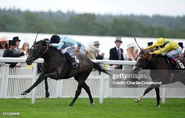 Ryan Moore riding Opinion lands the Duke of Edinburgh Handicap ahead of Frankie Dettori riding Stencive during day five of Royal Ascot at Ascot...