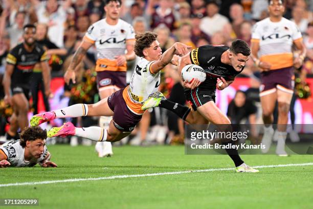 Nathan Cleary of the Panthers gets past Reece Walsh of the Broncos before scoring a try during the 2023 NRL Grand Final match between Penrith...