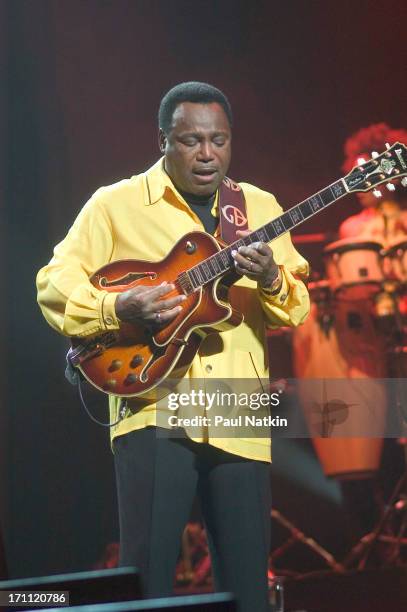 American jazz and R&B musician George Benson performs with his band on stage at the Oriental Theater, Chicago, Illinois, May 1, 2004.