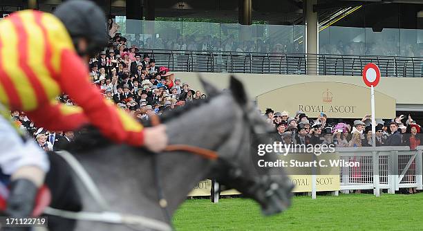 Racegoers look on from the grandstand on day five of Royal Ascot at Ascot Racecourse on June 22, 2013 in Ascot, England.