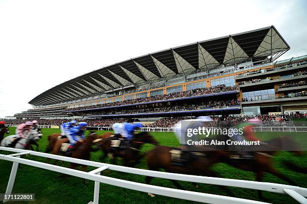 Runners go past the grandstand in the Queen Alexandra Stakes during day five of Royal Ascot at Ascot Racecourse on June 22, 2013 in Ascot, England.