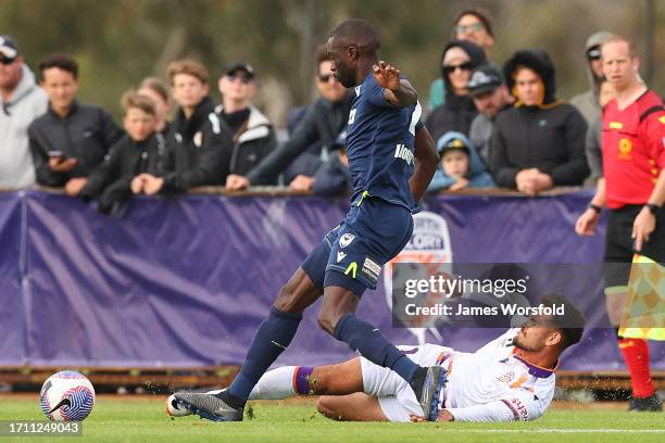 Riley Warland of the Glory slides in to tackle Jason Geria of the Victory during the A-League Mens pre-season match between Perth Glory and Melbourne...