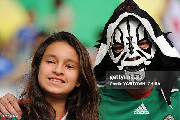 Supporters of Mexico pose on the stands before the start of the FIFA Confederations Cup Brazil 2013 Group A football match between Japan and Mexico,...