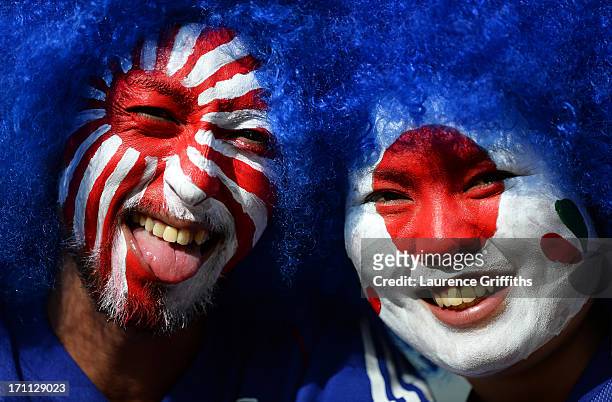 Fans with painted faces pose for a photo during the FIFA Confederations Cup Brazil 2013 Group A match between Japan and Mexico at Estadio Mineirao on...