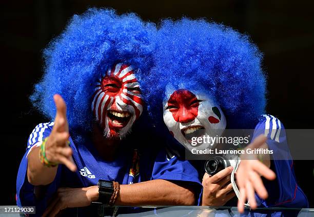 Fans wearing wigs and with painted faces pose for a photo during the FIFA Confederations Cup Brazil 2013 Group A match between Japan and Mexico at...