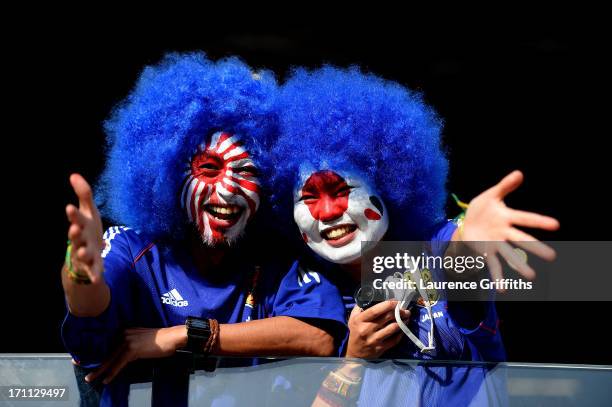 Fans wearing wigs and with painted faces pose for a photo during the FIFA Confederations Cup Brazil 2013 Group A match between Japan and Mexico at...