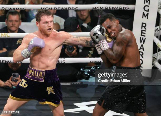 Canelo Alvarez throws a left at Jermell Charlo in the fifth round of their super middleweight title fight at T-Mobile Arena on September 30, 2023 in...