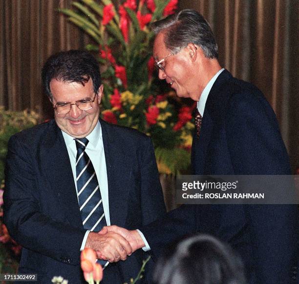 Italian Prime Minister Romano Prodi is greeted by his Singaporean counterpart Goh Chok Tong after a speech during a lunch hosted by Goh at the...