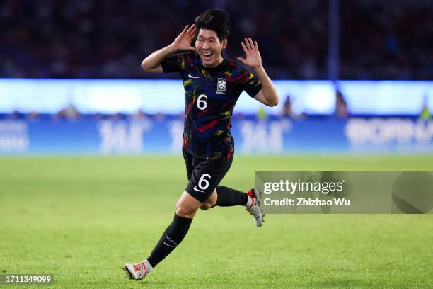 Hong Hyunseok of South Korea celebrates his goal by free kicks during the 19th Asian Game Men's Quarterfinal between China and South Korea at...