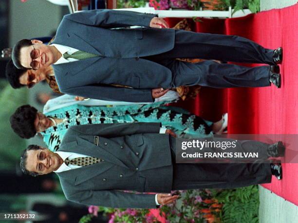 Malaysian Prime Minister Mahathir Mohamad walks with his Chinese counterpart Li Peng during a welcoming ceremony at parliament square 21 August. Li...