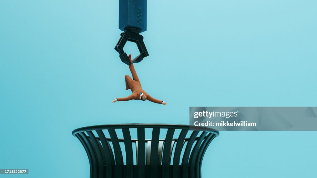 Robotic arm throws man in the garbage can