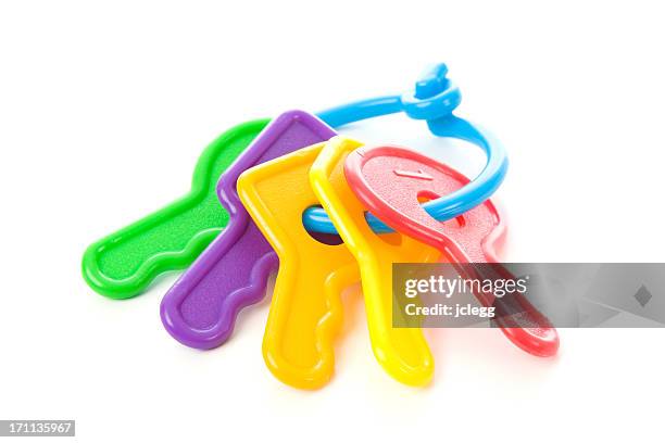 multi colored keys for a baby - plastic toy stock pictures, royalty-free photos & images