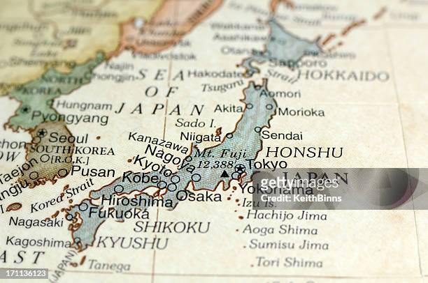 antique map displaying japan and surrounding areas - japan stock pictures, royalty-free photos & images
