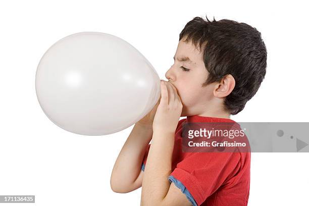 boy blowing up a balloon - blowing balloon stock pictures, royalty-free photos & images