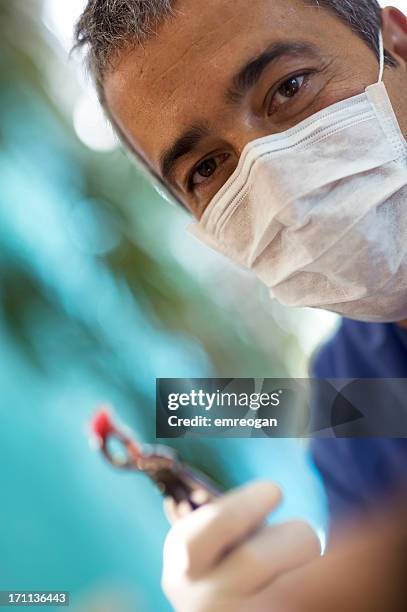 dentist - tooth extraction stock pictures, royalty-free photos & images