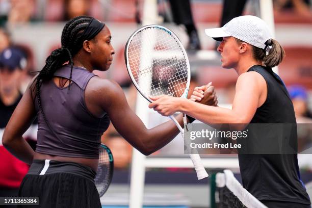 Coco Gauff of the United States shakes hands with Iga Swiatek of Poland during the Women's Singles semifinal match during day 12 of the 2023 China...
