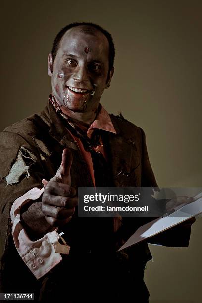 thumbs up zombie - halloween zombie makeup stock pictures, royalty-free photos & images