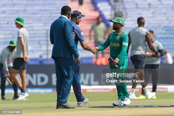 Dasun Shanaka of the Sri Lanka and Temba Bavuma of the South Africa and shake after toss during the ICC Men's Cricket World Cup India 2023 between...