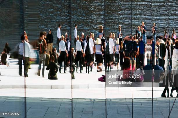 group of  people reflected in a glass facade. - oslo people stock pictures, royalty-free photos & images