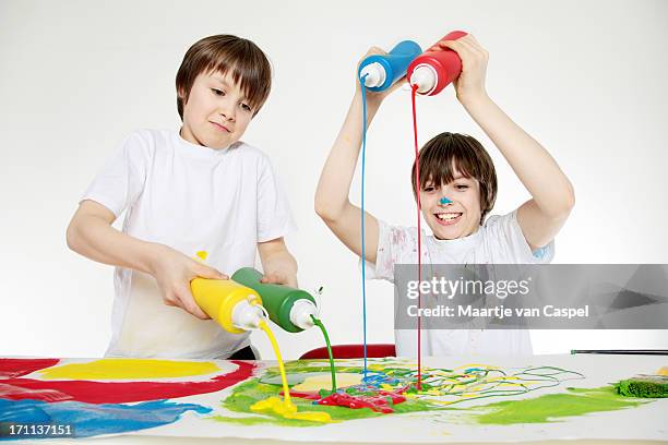 children having fun with paint - squirting stock pictures, royalty-free photos & images