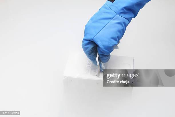 container with liquid nitrogen...doctor in hazmat suit at work - liquid nitrogen stock pictures, royalty-free photos & images