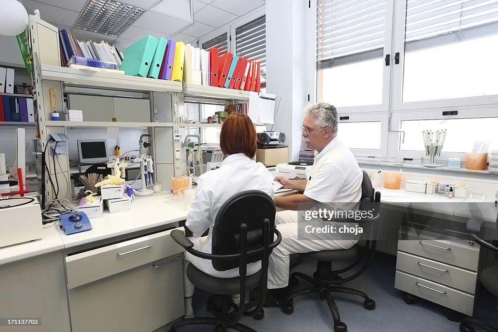 Chief doctor and technicianin a blood bank