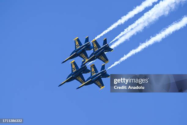 Blue Angels planes fly near Alcatraz Island and Golden Gate Bridge during Fleet Week Air Show in San Francisco, California, United States on October...
