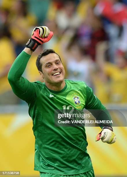 Brazil's goalkeeper Julio Cesar celebrates after defender Dante scored against Italy during their FIFA Confederations Cup Brazil 2013 Group A...