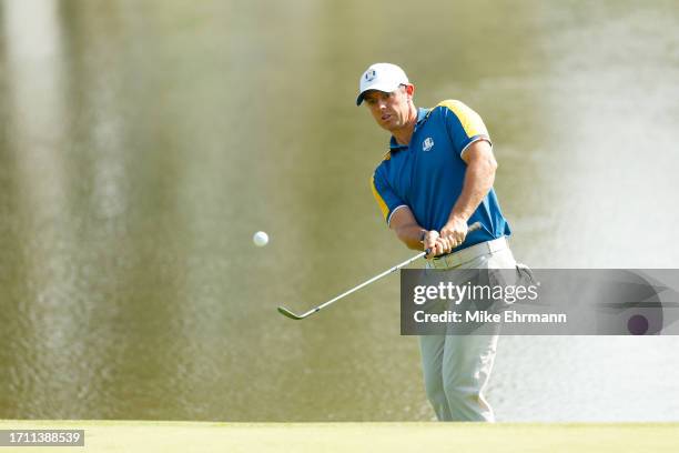 Rory McIlroy of Team Europe chips onto the eighth green during the Sunday singles matches of the 2023 Ryder Cup at Marco Simone Golf Club on October...