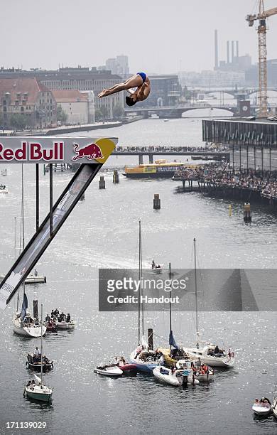 In this handout image provided by Red Bull, Jonathan Paredes of Mexico dives from the 28 metre platform at the Copenhagen Opera House during the...