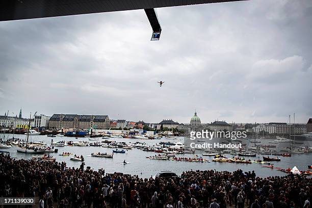 In this handout image provided by Red Bull, Anatoliy Shabotenko of the Ukraine dives from the 28 metre platform at the Copenhagen Opera House during...