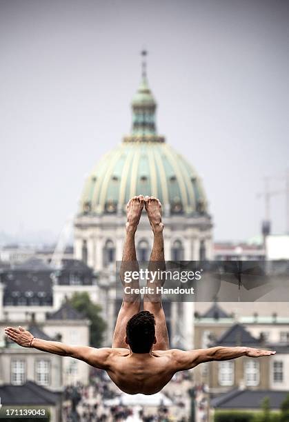 In this handout image provided by Red Bull, Jonathan Paredes of Mexico dives from the 28 metre platform at the Copenhagen Opera House during the...