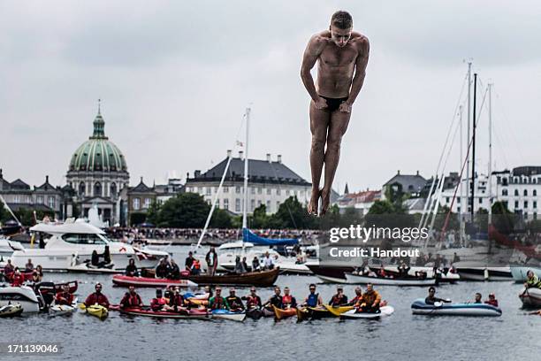 In this handout image provided by Red Bull, Artem Silchenko of Russia prepares for his water entry after diving from the 28 metre platform at the...