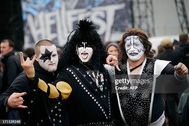 Fans of US rock band Kiss pose during the Hellfest Heavy Music Festival on June 22, 2013 in Clisson, western France. AFP PHOTO JEAN-SEBASTIEN EVRARD