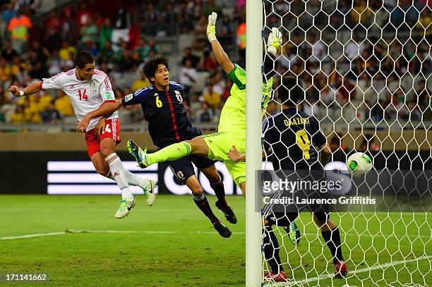 Javier Hernandez of Mexico scores a goal past Eiji Kawashima, Atsuto Uchida and Shinji Okazaki of Japan during the FIFA Confederations Cup Brazil...